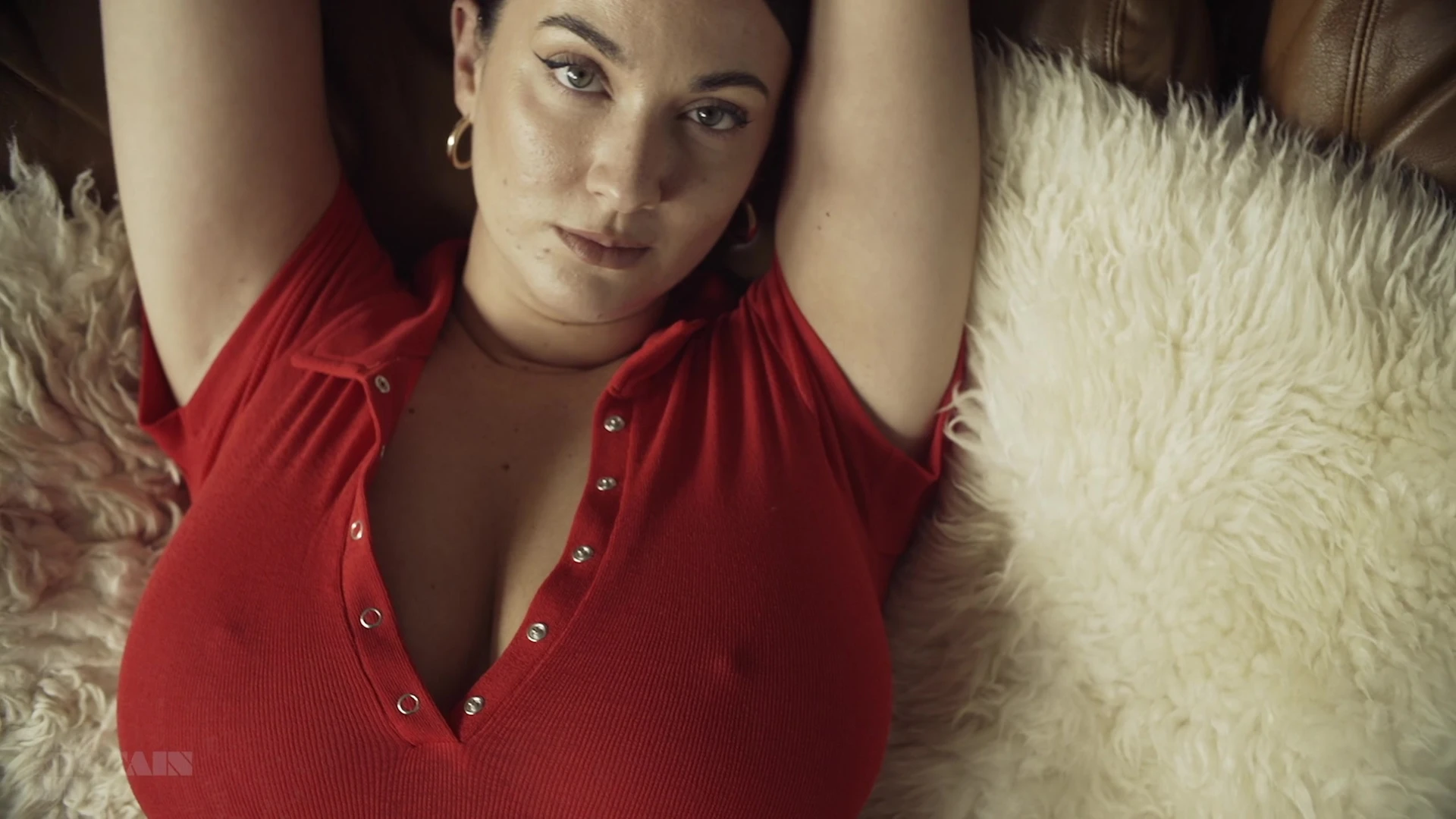 horny babe Joey Fisher showing off her big boobs in red shirt