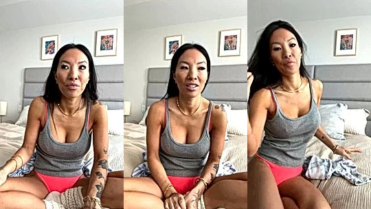 Asa Akira teasing her tits wearing socks in bed