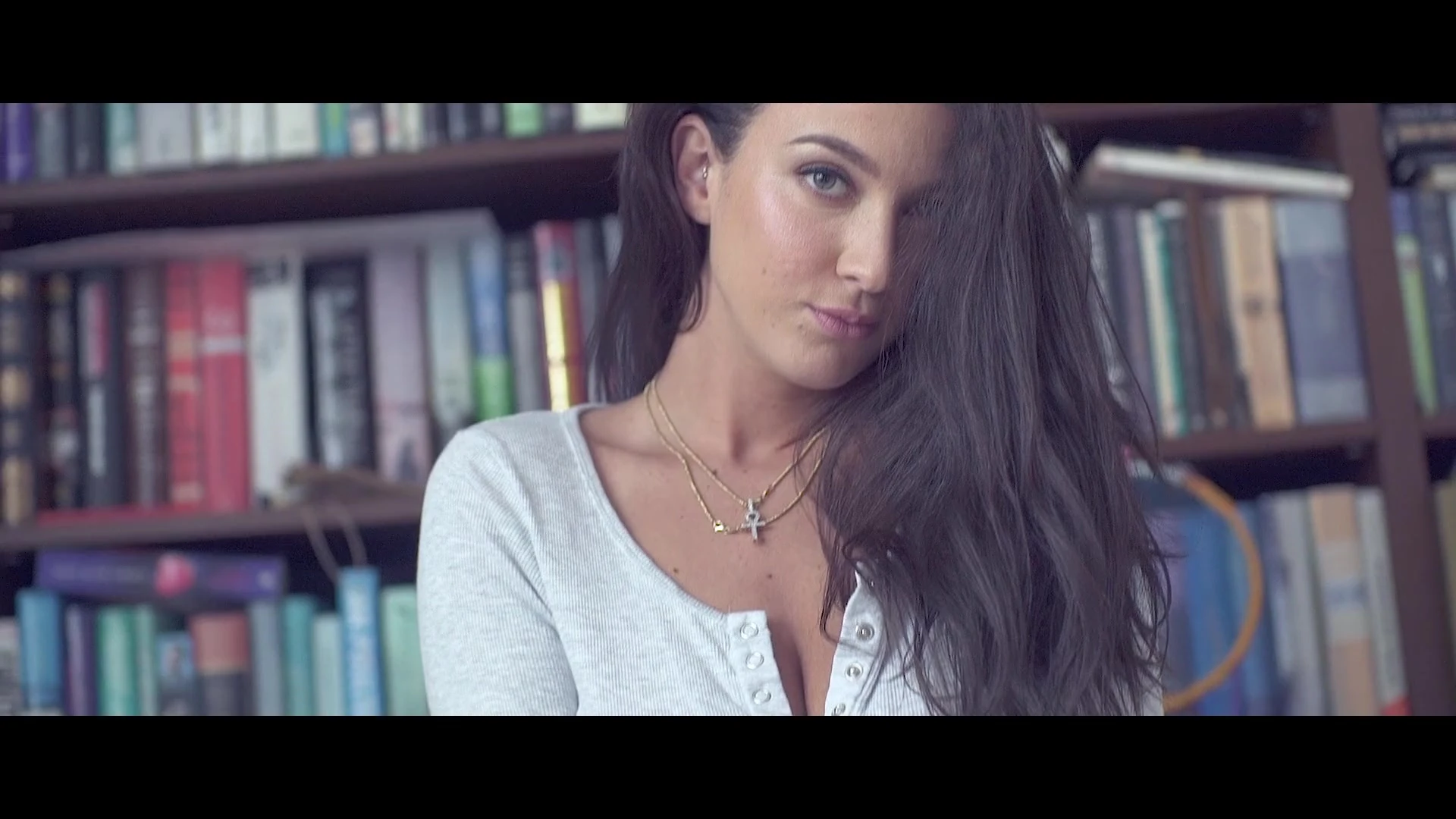 hot babe Joey Fisher teasing her sexy body in the library