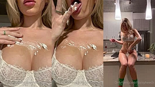 Daisy keech playing with whipped cream in kitchen