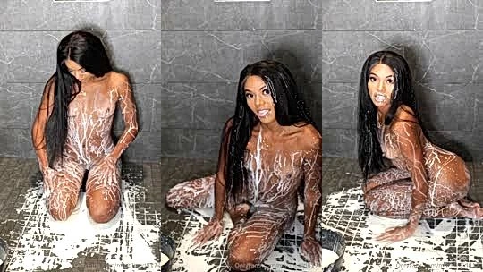 Sophie Vanmeter pouring milk on her naked body